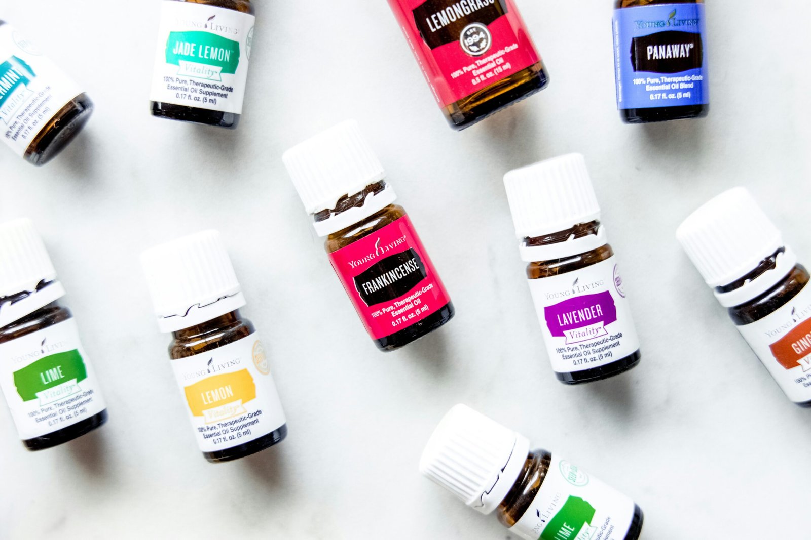 a group of bottles of essential oils on a table